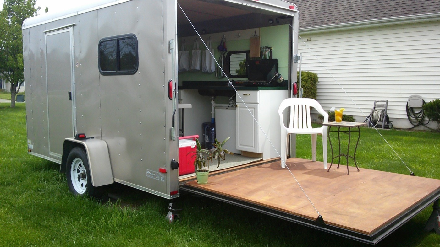 Woman Converts Cargo Trailer into Stealthy and Cozy Off-Grid RV